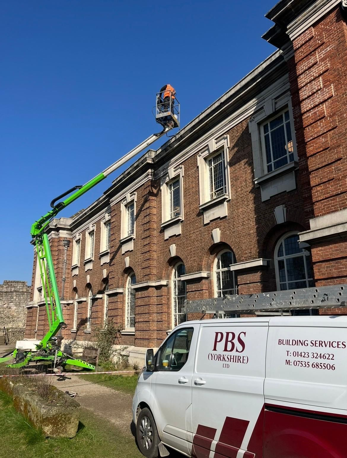 PBS Yorkshire van at heritage brick building
