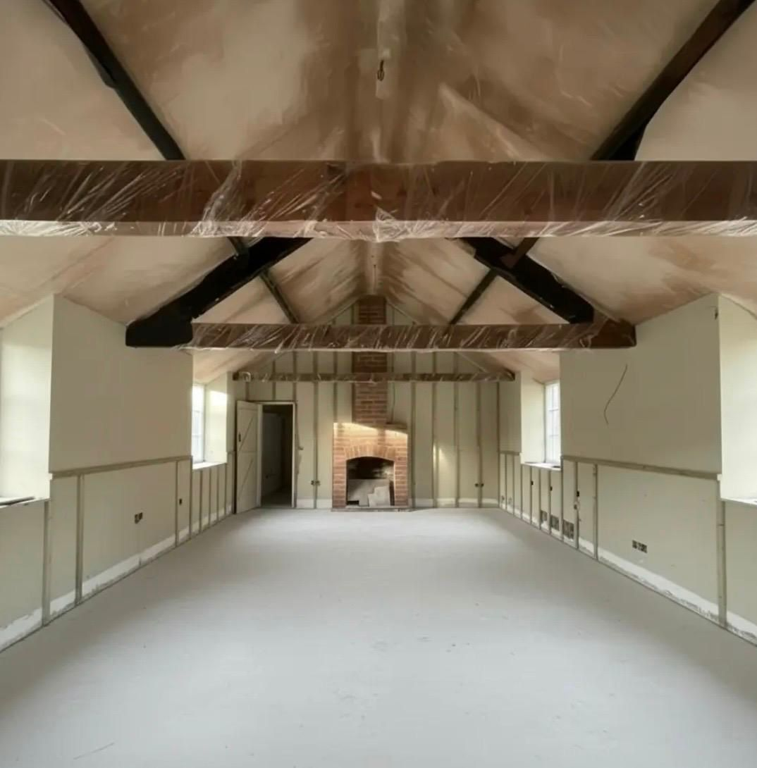 Barn conversion interior with exposed beams